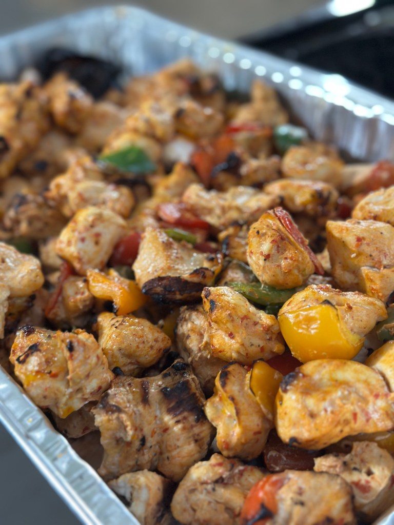 Mint Kitchen grills delicious chicken shish kabobs with bell peppers