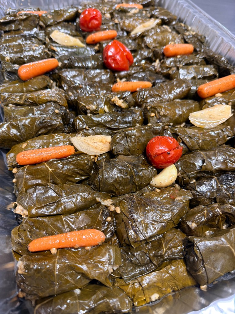 Yalanji is a delicious vegetarian Syrian dish of rice-stuffed grape leaves